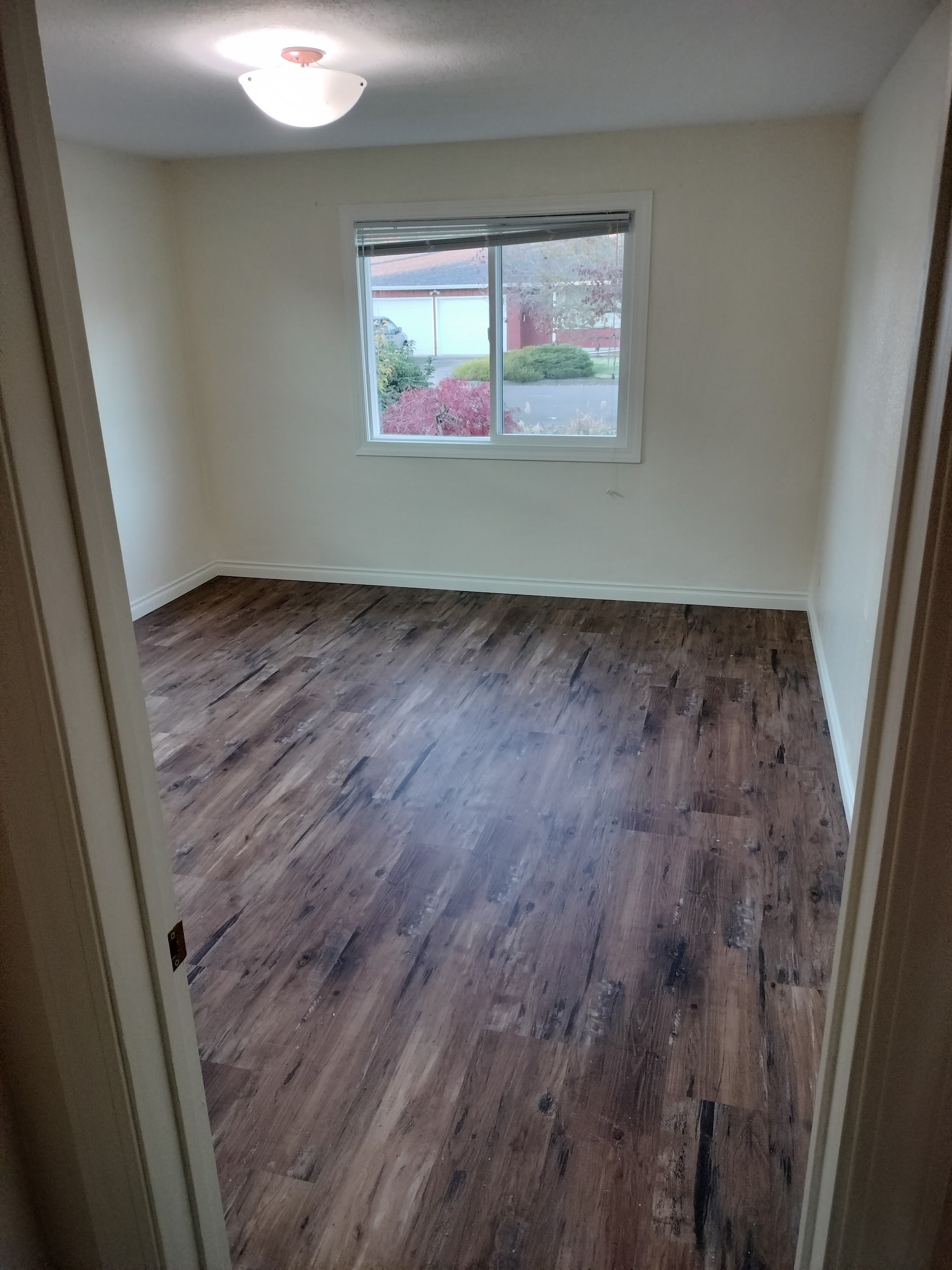 Freshly laid vinyl plank flooring in a bedroom