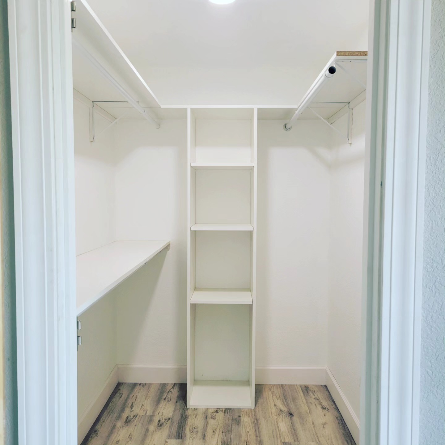 Custom white built-in closet shelving system