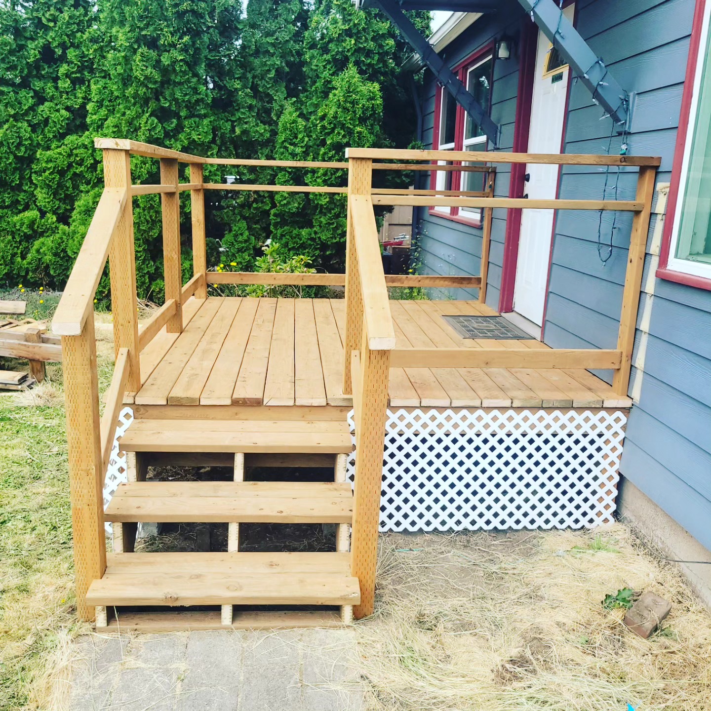 Cedar deck and stairs with white lattice skirting